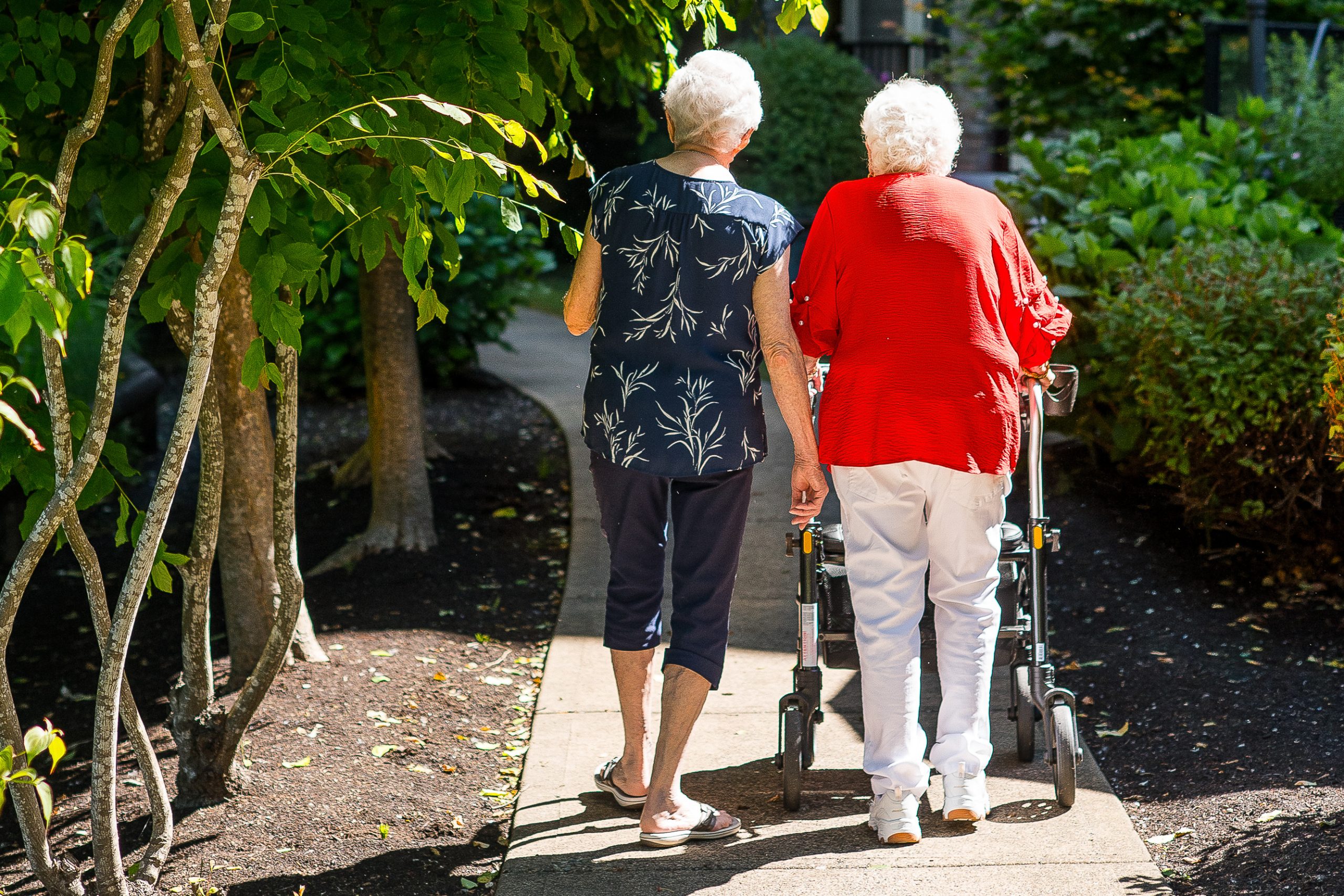 two senior woman walking